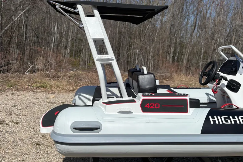 Slide: The Image of Highfield Velox 420 boat, 2025 model, parked outdoors. - 7