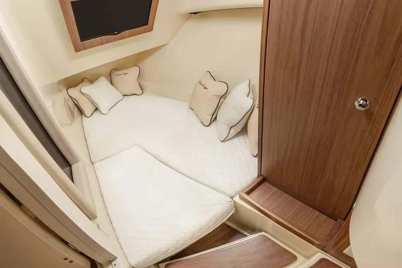 Slide: The Image of Manufacturer Provided Image: Luxurious cabin interior of 2026 Chris-Craft Launch 35 GT with plush bedding. - 5
