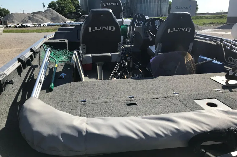 Slide: The Image of 2011 Lund 1775 Impact fishing boat interior with equipment and seating. - 10