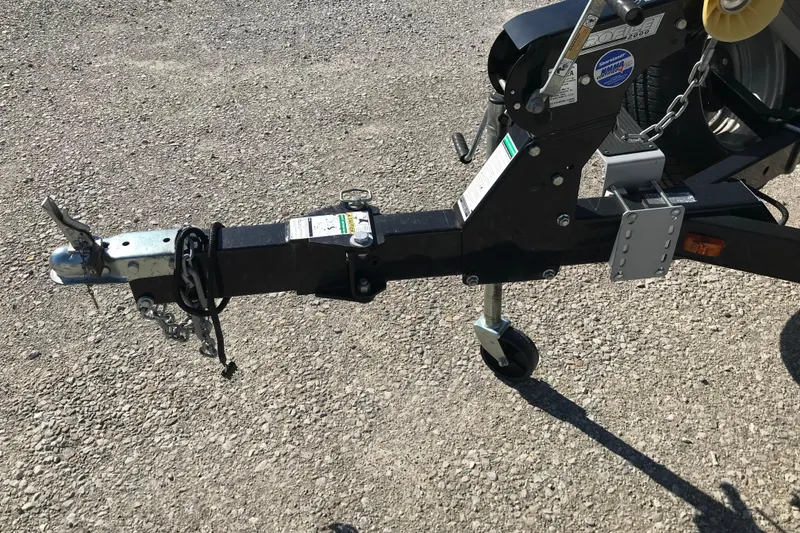 Slide: The Image of Trailer hitch of a 2011 Lund 1775 Impact boat on gravel surface. - 17