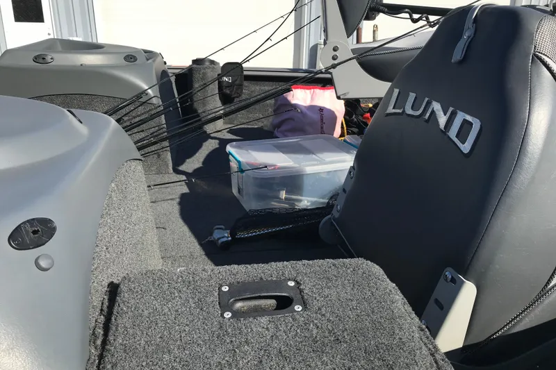 Slide: The Image of Interior of a 2011 Lund 1775 Impact boat with fishing gear and storage box. - 20