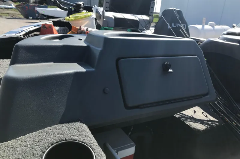 Slide: The Image of 2011 Lund 1775 Impact boat dashboard with storage compartment and cup holder. - 23