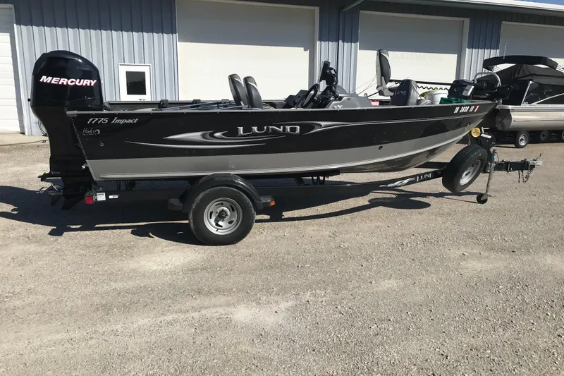 The Image of 2011 Lund 1775 Impact fishing boat on trailer, parked outdoors. - 7