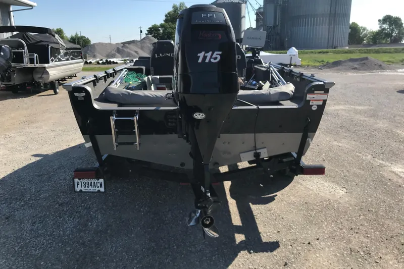 Slide: The Image of Rear view of a 2011 Lund 1775 Impact boat with an outboard motor. - 9