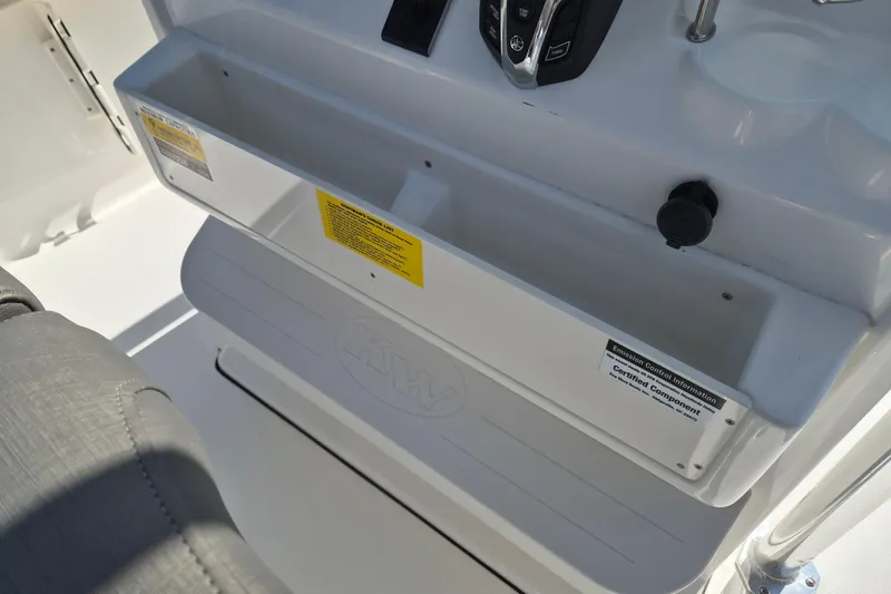 Slide: The Image of 2026 Key West 239 FS boat console with storage compartment and control panel. - 10