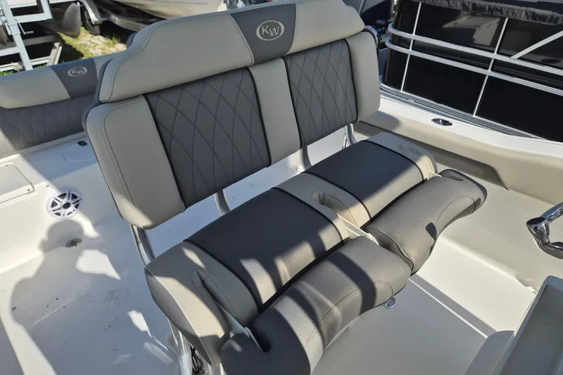 Slide: The Image of 2026 Key West 239 FS boat seating with gray cushioned upholstery and sleek design. - 11