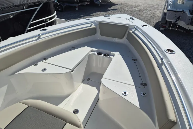 Slide: The Image of 2026 Key West 239 FS boat interior with seating and storage compartments. - 13