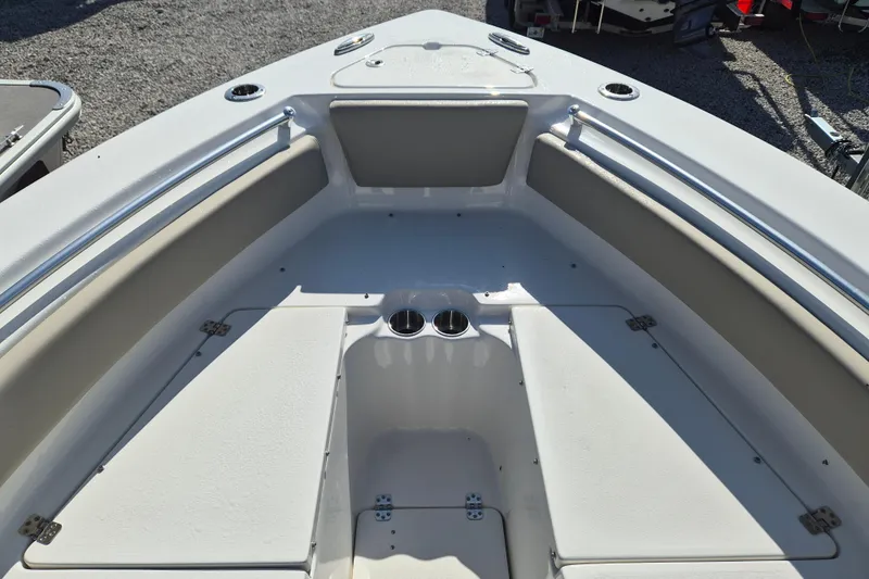 Slide: The Image of 2026 Key West 239 FS boat interior with cushioned seating and cup holders. - 14