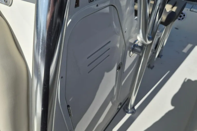 Slide: The Image of 2026 Key West 239 FS boat interior with stainless steel railing and storage compartment. - 19