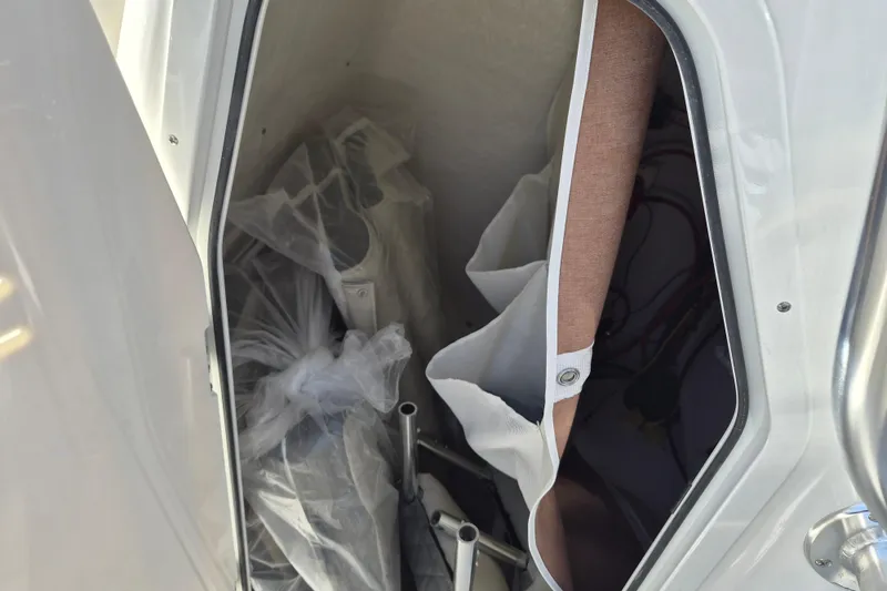 Slide: The Image of Storage compartment of 2026 Key West 239 FS boat with equipment and accessories. - 20