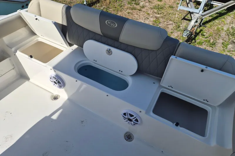 Slide: The Image of 2026 Key West 239 FS boat interior with storage compartments and seating. - 3