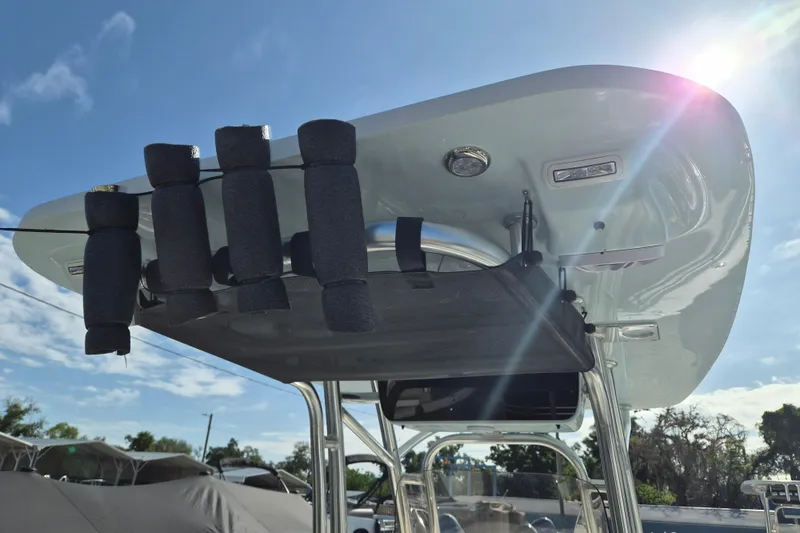 Slide: The Image of 2026 Key West 239 FS boat with T-top and rod holders under sunny sky. - 7