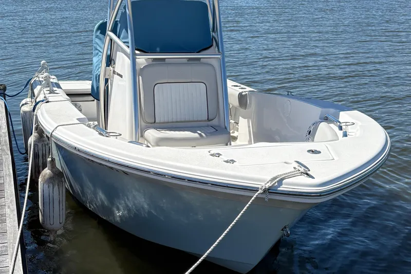 Slide: The Image of 2021 Sea Fox 206 Commander boat docked on calm water. - 2