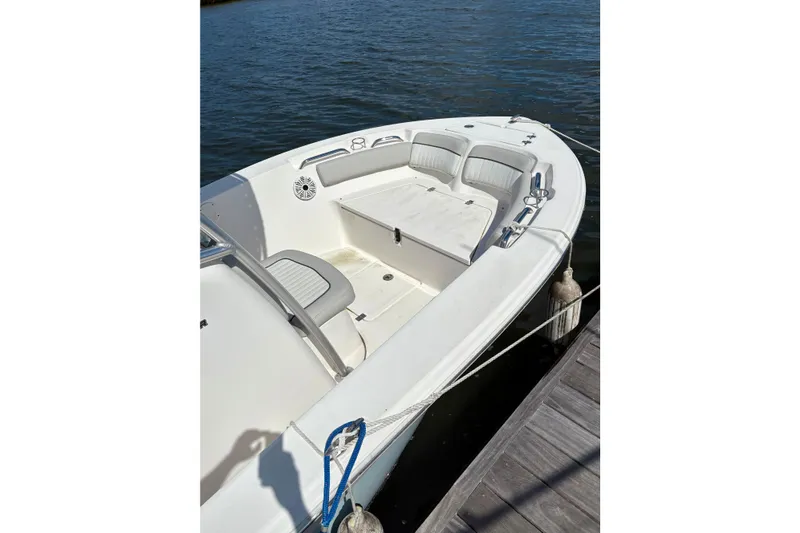 Slide: The Image of 2021 Sea Fox 206 Commander boat docked, featuring spacious seating and sleek design. - 3