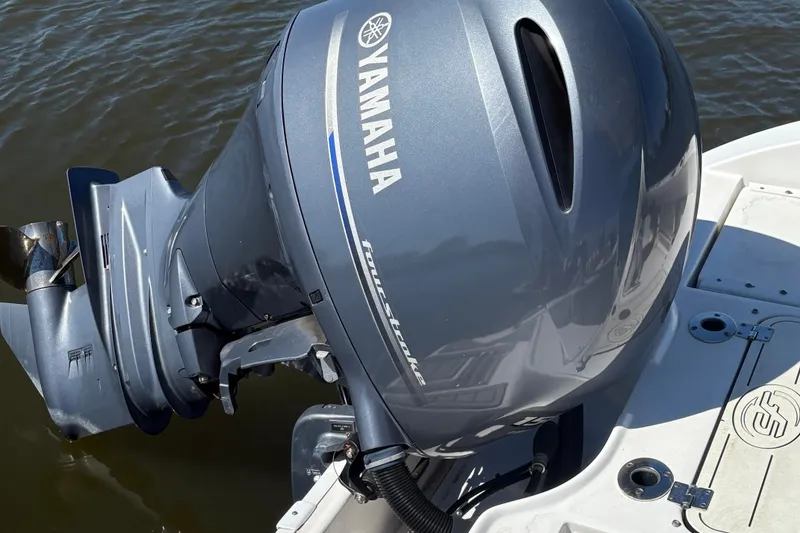 Slide: The Image of Yamaha outboard motor on 2021 Sea Fox 206 Commander boat, docked on water. - 4