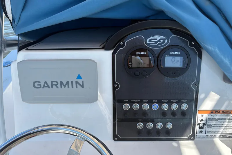Slide: The Image of Control panel of a 2021 Sea Fox 206 Commander boat with Garmin and Yamaha displays. - 5