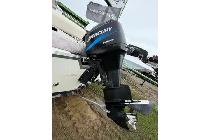 Slide: The Image of Kenner 18-V 2003 boat with Mercury Saltwater outboard motor on display. - 4