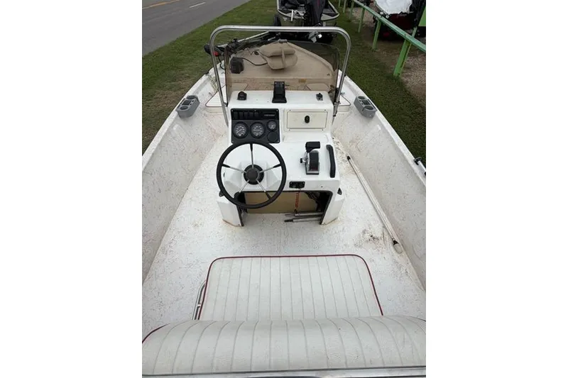 Slide: The Image of 2003 Kenner 18-V boat interior with steering wheel and control panel. - 5