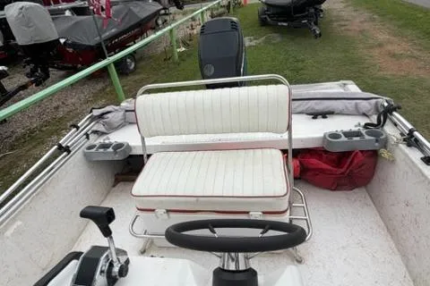 Slide: The Image of 2003 Kenner 18-V boat interior with steering wheel and seating. - 7