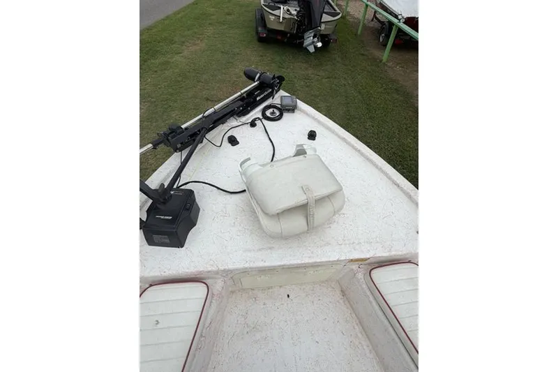 Slide: The Image of Kenner 18-V boat deck with equipment, 2003 model, featuring a trolling motor and storage bag. - 9