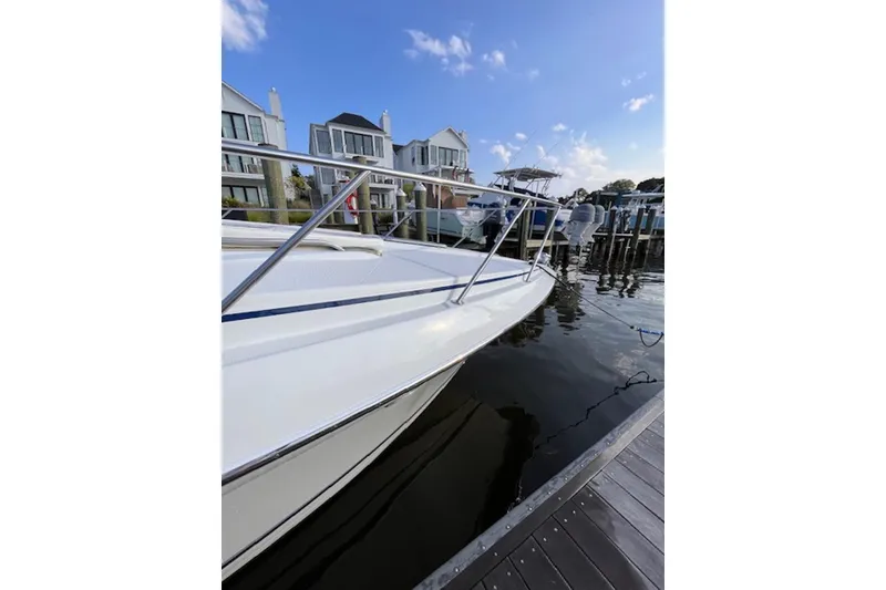 Slide: The Image of 2011 Formula 37 Performance Cruiser docked near waterfront homes. - 11