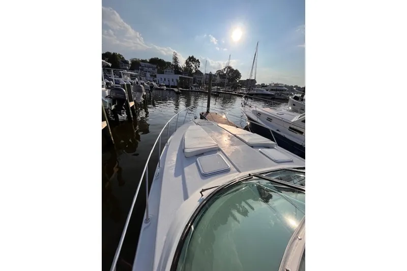 Slide: The Image of 2011 Formula 37 Performance Cruiser docked at marina under sunny sky. - 12