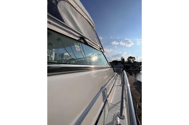 Slide: The Image of 2011 Formula 37 Performance Cruiser docked under a clear blue sky. - 13