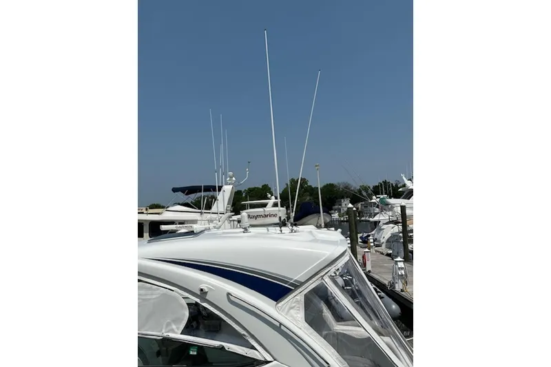 Slide: The Image of 2011 Formula 37 Performance Cruiser docked, featuring antennas and Raymarine equipment. - 14