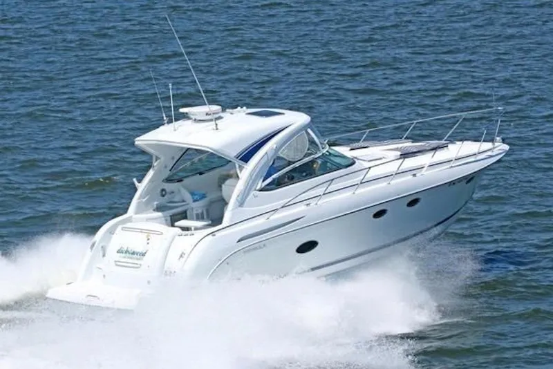 Slide: The Image of 2011 Formula 37 Performance Cruiser speeding on open water. - 2