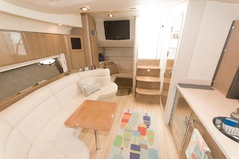 Slide: The Image of Luxurious interior of a 2011 Formula 37 Performance Cruiser with modern amenities and cozy seating. - 20