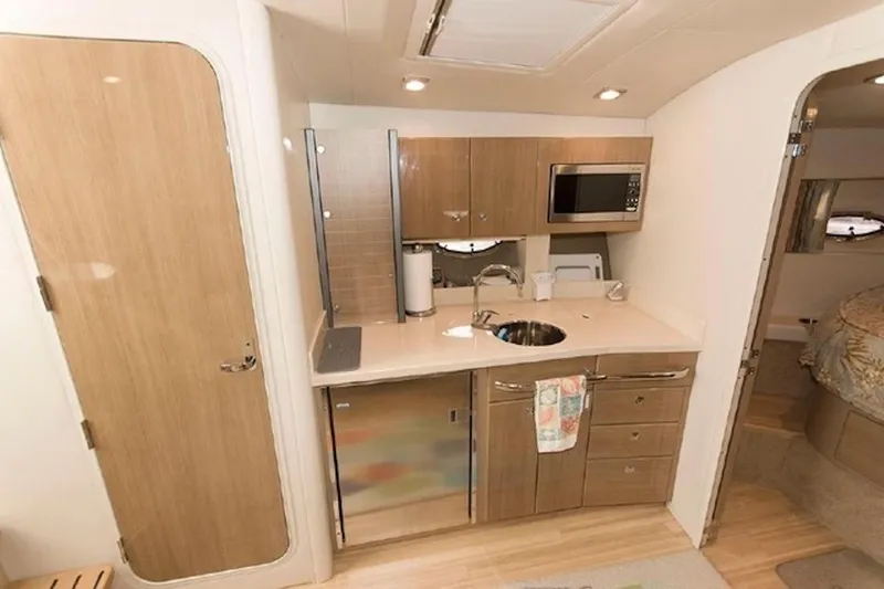 Slide: The Image of Interior of 2011 Formula 37 Performance Cruiser with kitchenette and modern amenities. - 23