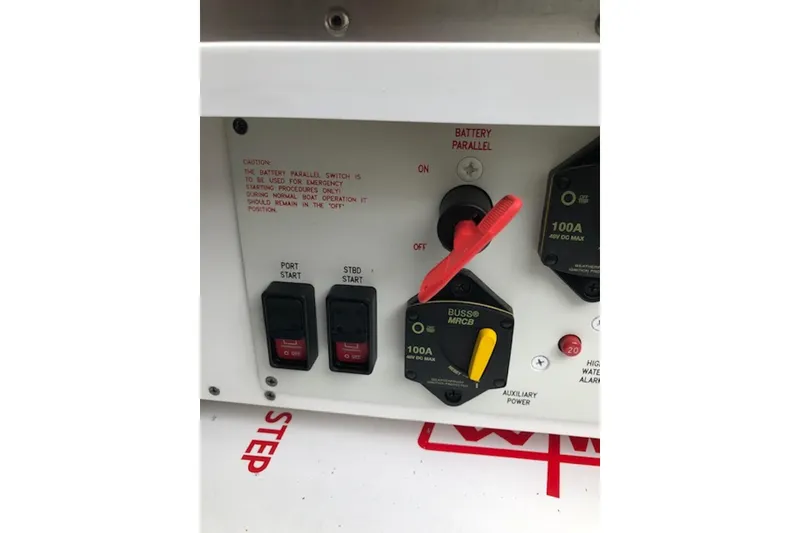 Slide: The Image of Control panel of a 2011 Formula 37 Performance Cruiser with battery switches and start buttons. - 30