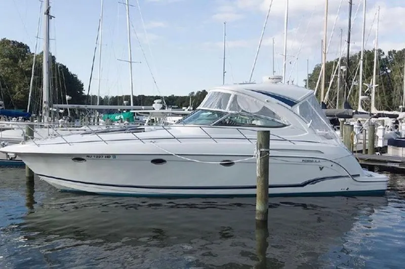 Slide: The Image of 2011 Formula 37 Performance Cruiser docked at marina, side view. - 4