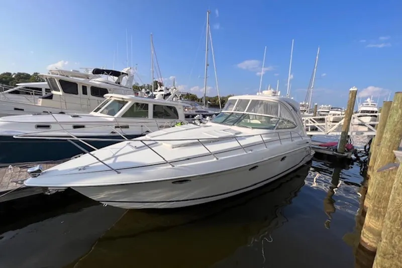 Slide: The Image of 2011 Formula 37 Performance Cruiser docked at marina under clear blue sky. - 6