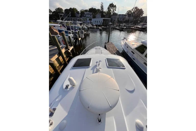 Slide: The Image of 2011 Formula 37 Performance Cruiser docked at marina, showcasing sleek deck design. - 7
