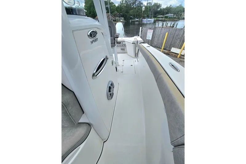 Slide: The Image of 2021 Sea Pro 259 Center Console boat interior with seating and console details. - 11