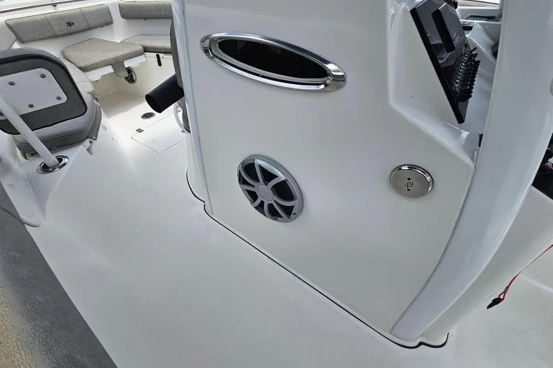 Slide: The Image of 2021 Sea Pro 259 Center Console interior with seating and control panel. - 18