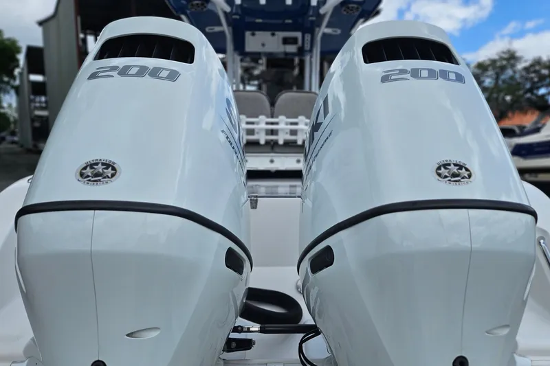 Slide: The Image of Twin Suzuki 200 outboard engines on a 2021 Sea Pro 259 Center Console boat. - 4