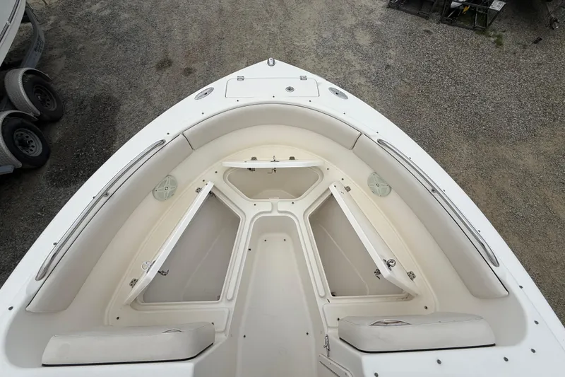 Slide: The Image of 2007 Robalo R227 Dual Console boat interior, featuring spacious seating and storage compartments. - 11