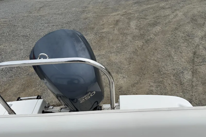 Slide: The Image of 2007 Robalo R227 Dual Console with Yamaha 250 engine on gravel surface. - 12