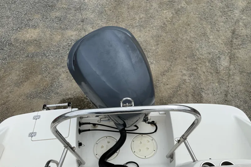 Slide: The Image of 2007 Robalo R227 Dual Console boat engine and deck view. - 16