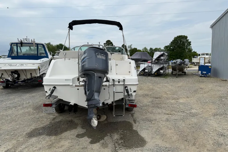 Slide: The Image of 2007 Robalo R227 Dual Console boat with Yamaha 250 outboard motor in a marina. - 19