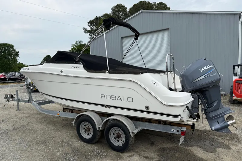 The Image of 2007 Robalo R227 Dual Console boat on trailer with Yamaha outboard motor. - 2