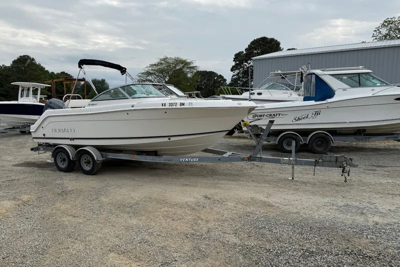 Slide: The Image of 2007 Robalo R227 Dual Console boat on trailer in outdoor storage area. - 22