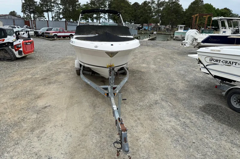 Slide: The Image of 2007 Robalo R227 Dual Console boat on trailer in a gravel lot. - 6