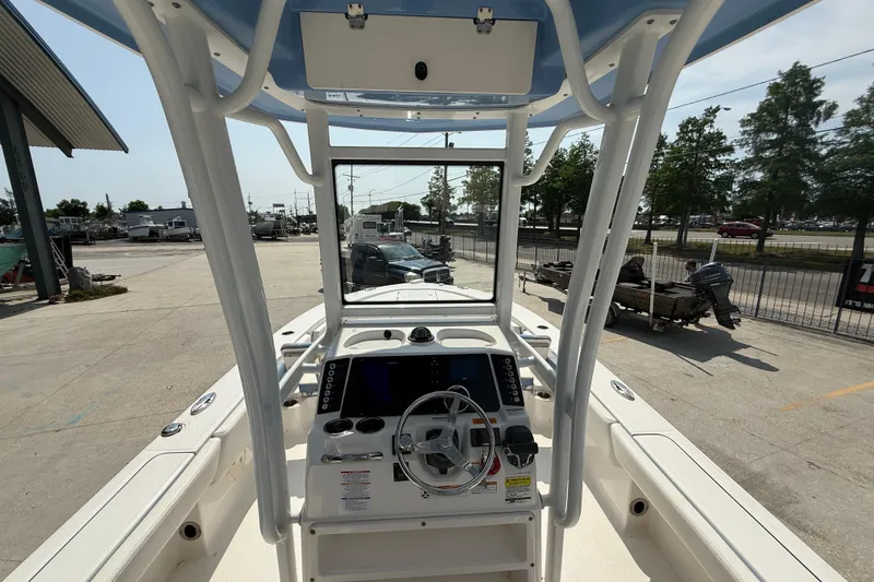 Slide: The Image of 2023 Robalo 246 Cayman boat interior with steering console and navigation equipment. - 14