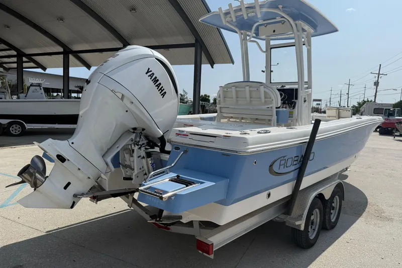 Slide: The Image of 2023 Robalo 246 Cayman boat with Yamaha engine on trailer. - 6