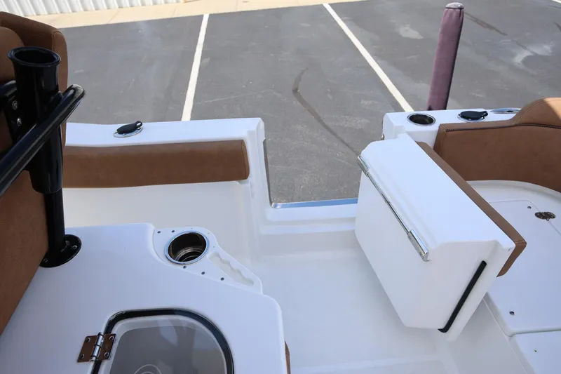Slide: The Image of 2022 Sea Hunt Ultra 239 SE boat interior with seating and storage compartments. - 11