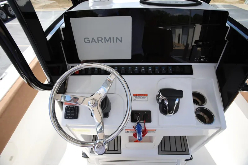 Slide: The Image of 2022 Sea Hunt Ultra 239 SE boat dashboard with Garmin navigation system. - 13