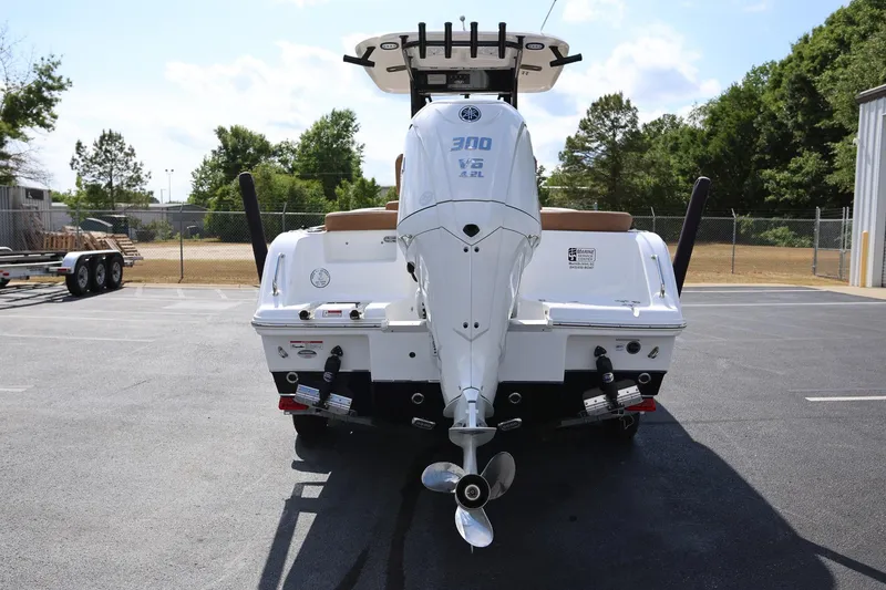 Slide: The Image of 2022 Sea Hunt Ultra 239 SE boat with Yamaha 300 V6 engine, parked outdoors. - 3